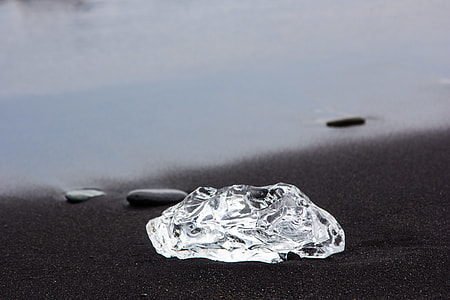 clear photography of a chrystal fragment in black surface thumbnail