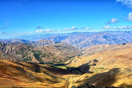 mountains under blue sky at daytime thumbnail
