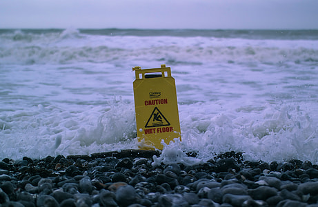 Caution wet floor signage on beach thumbnail