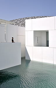 man looking at concrete house thumbnail