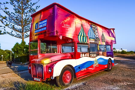 red and white double-deck bus outdoors thumbnail