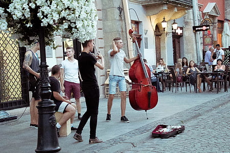 man playing violin and cello at the street thumbnail