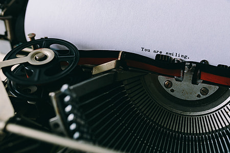 Closeup view of typing quotes on the old typewriter thumbnail