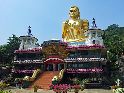 gold Buddha statue on building thumbnail