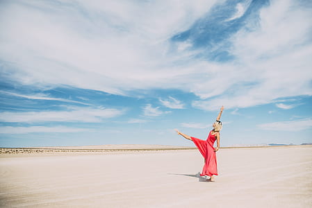 woman standing on one leg at beach thumbnail