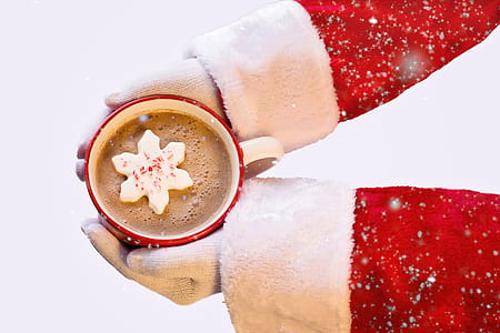 person holding red and white mug filled with coffee thumbnail
