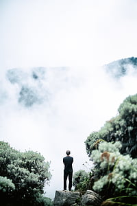 man standing on rock thumbnail