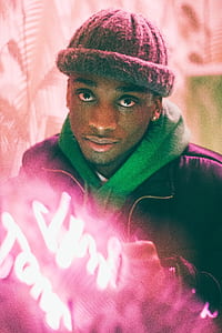 man wearing purple jacket at daytime thumbnail