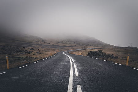 landscape photography of brown mountain with asphalt road thumbnail