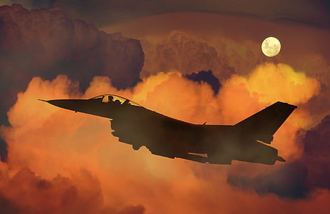 silhouette of fighter jet on clouds thumbnail