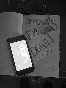 turned-on iPhone 5 on opened book with i'm done text thumbnail