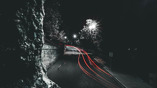 time lapse photography of road near trees thumbnail