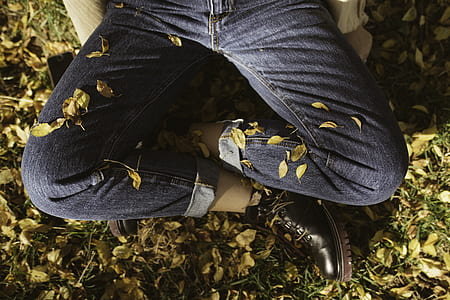 person sitting on ground on leaves thumbnail