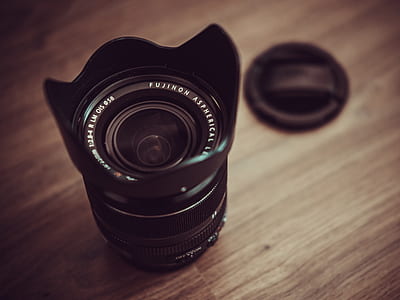 selective focus photography of black DSLR camera lens thumbnail