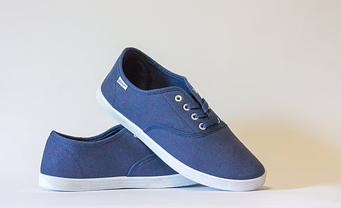 blue-and-white low-top sneakers on white surface thumbnail