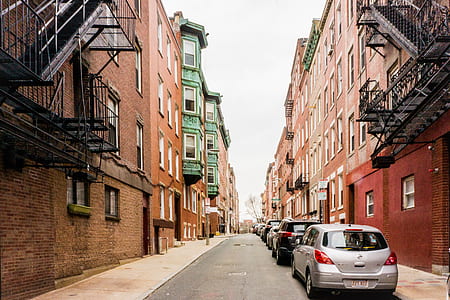 parked cars in between buildings thumbnail