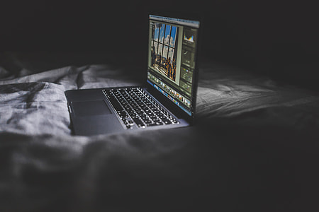 Photo Editing on MacBook at Night thumbnail