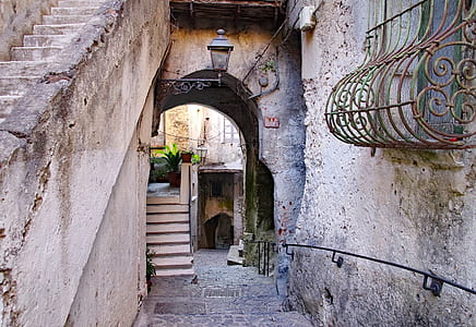 concrete staircase in the middle of buildings thumbnail