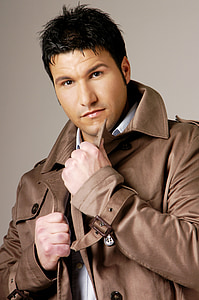 man wearing brown coat thumbnail
