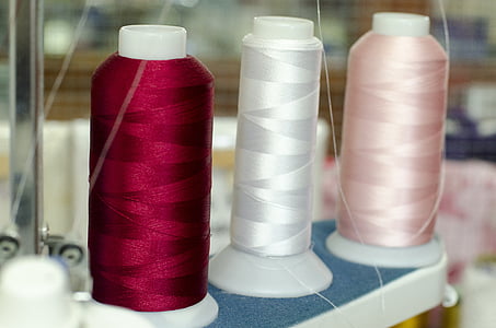 used pink, white, and red thread rolls thumbnail