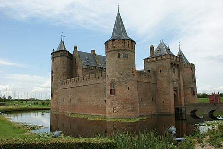 photo of castle surrounded by water thumbnail