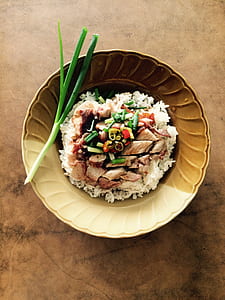 brown ceramic bowl with rice dish inside thumbnail