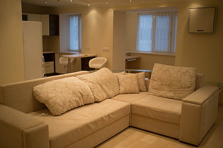throw pillows on white corner sofa thumbnail