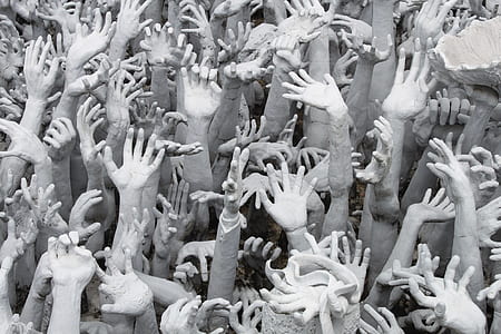 human hands statue in grayscale photo thumbnail