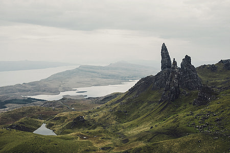 green mountains under cloudy sky thumbnail