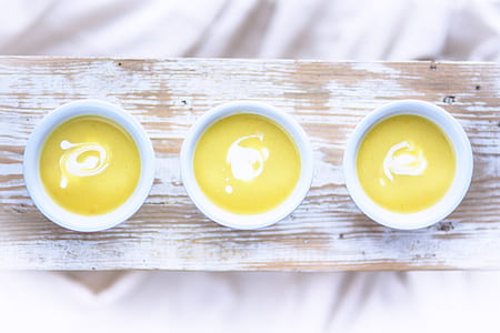 three white-and-yellow scented candles thumbnail