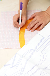 person holding white and purple pen thumbnail