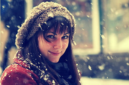 woman in gray knitted cap smiling thumbnail