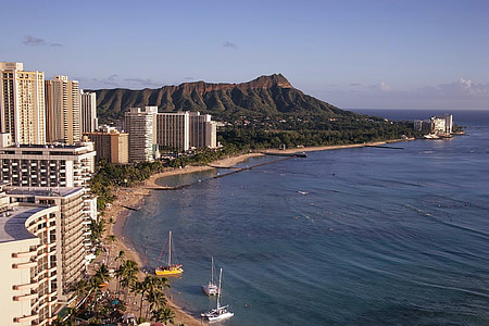 aerial view of city buildings and body of water thumbnail