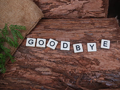 white scrabble tiles with goodbye text thumbnail