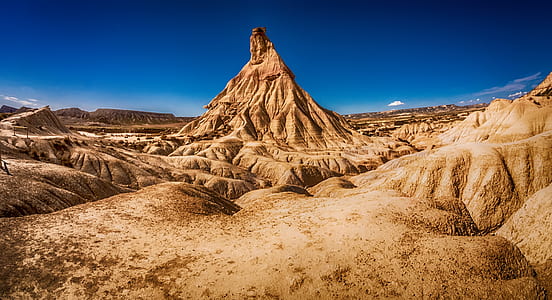 landscape photography of cliffs and monolith thumbnail
