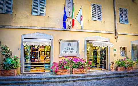 yellow and white Hotel Berchielli concrete building thumbnail