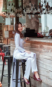 Women Sitting in the Bar Stool in Front of Bar Counter thumbnail