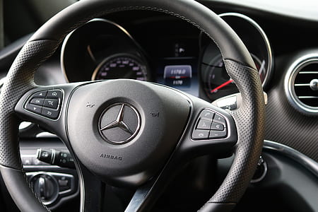 black Mercedes-Benz steering wheel thumbnail