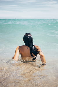 Woman Swims In Ocean Photo thumbnail