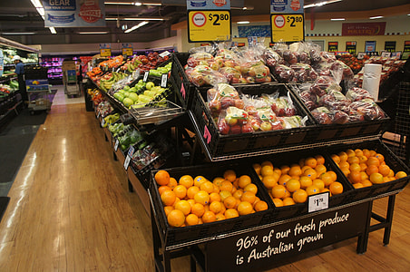 assorted fruits on fruit stand inside grocery thumbnail