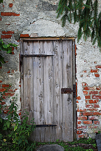 portrait photography of brown wooden door on concrete wall thumbnail