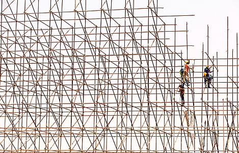 several men on bamboo scaffolding thumbnail