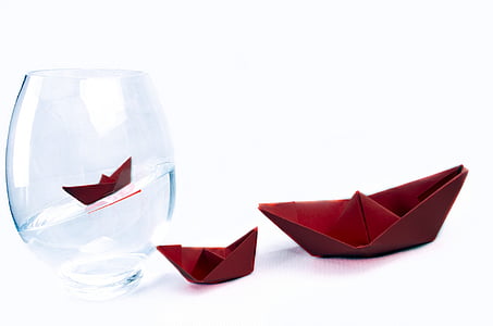 clear glass container beside of two red table napkins thumbnail