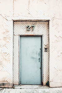 teal door with 27 wall sign thumbnail