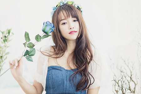 Woman Holding Blue Petaled Flower thumbnail