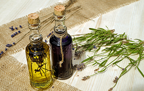clear glass bottle container on white wooden table thumbnail