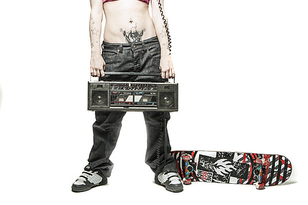 person holding boombox with skateboard photography thumbnail