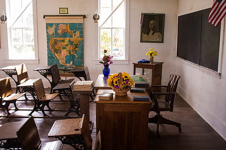 brown wooden table and chair set near on chalkboard thumbnail