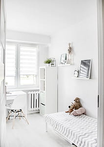 Plush Toys on Top of White and Grey Mattress Inside Bedroom thumbnail