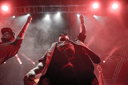 Two Men Standing Raising Right Hands thumbnail